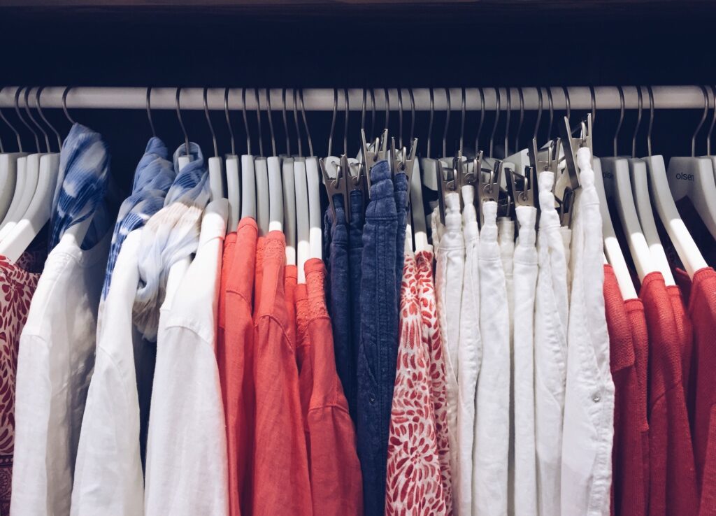 Women’s clothing hanging on a rack. Spring wardrobe